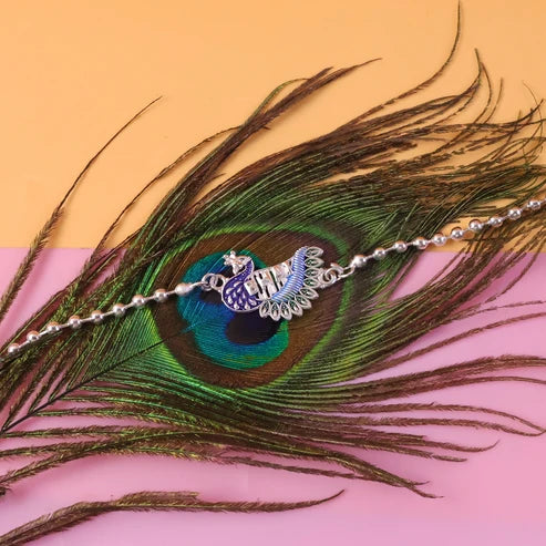 Rakshabandhan Silver Peacock Rakhi – Stylish & Traditional Design by madhavans