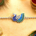 Rakshabandhan Silver Peacock Rakhi – Stylish & Traditional Design by madhavans