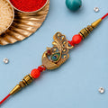 Peacock Rakhi – Golden Stone & Bead Designer Band for Brother